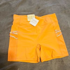 orange biker shorts